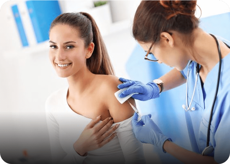 Nurse administering vaccine to patient
